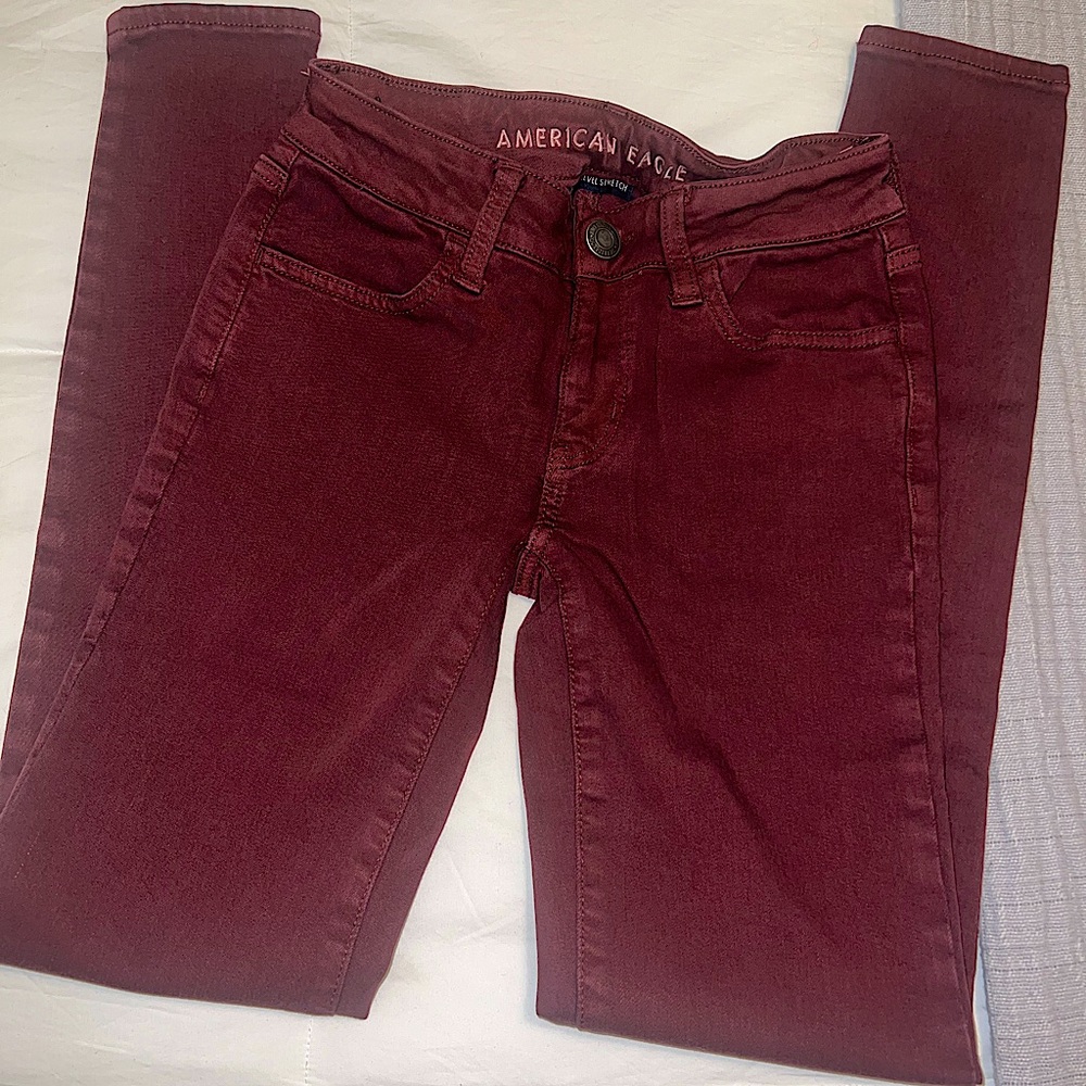 American Eagle Next Level Stretch Skinny Jeans in Maroon